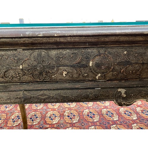 379 - An 18th century Italian gilt gesso console table, the top worked in low relief, over two slides and ... 