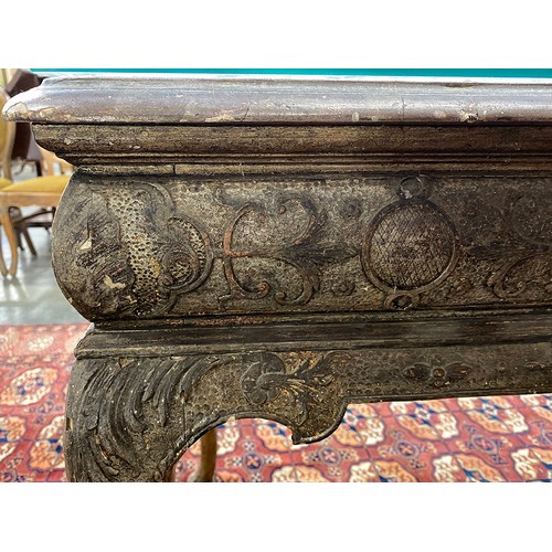 379 - An 18th century Italian gilt gesso console table, the top worked in low relief, over two slides and ... 