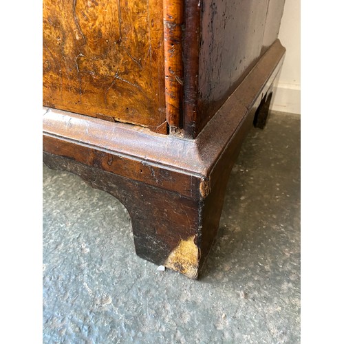 363 - An early 18th century walnut veneer cabinet on chest, the moulded cornice above a cushion frieze dra... 