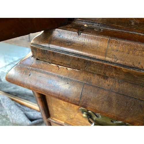 363 - An early 18th century walnut veneer cabinet on chest, the moulded cornice above a cushion frieze dra... 