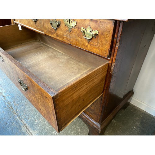 363 - An early 18th century walnut veneer cabinet on chest, the moulded cornice above a cushion frieze dra... 