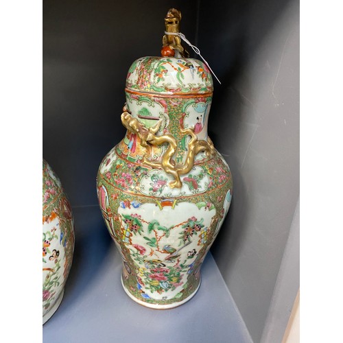 216 - Two Chinese famille rose porcelain vases, one with cover surmounted by foo dog, 36cm high and 41cm h... 