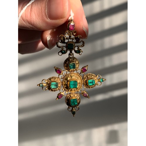 12 - An 18th century Iberian gold cross pendant set with emeralds, emerald paste, and rubies, the largest... 