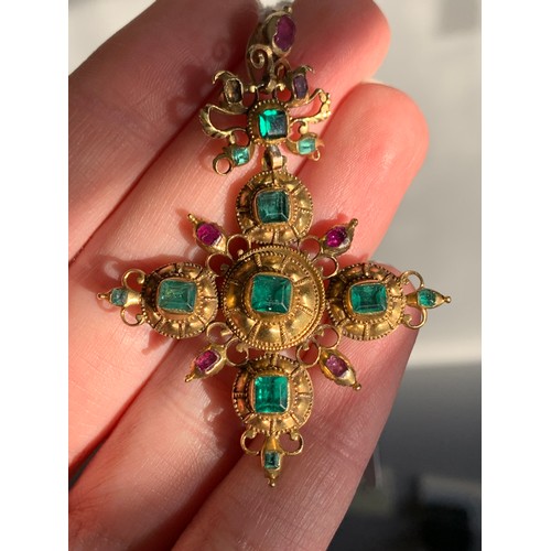 12 - An 18th century Iberian gold cross pendant set with emeralds, emerald paste, and rubies, the largest... 