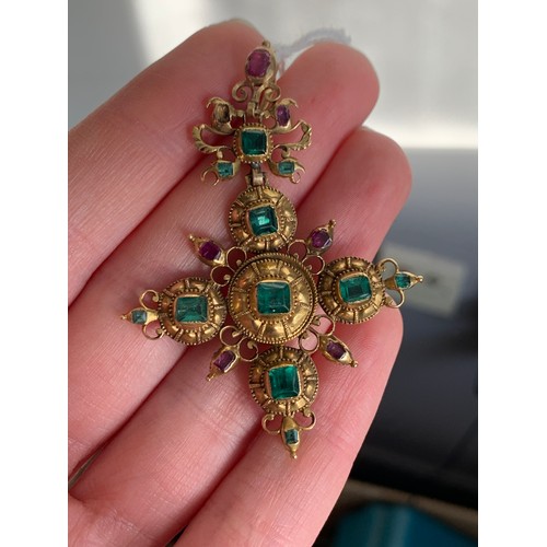 12 - An 18th century Iberian gold cross pendant set with emeralds, emerald paste, and rubies, the largest... 