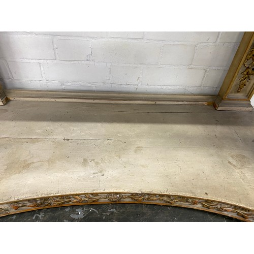 381 - A 19th century painted and gilt gesso Italian console table, the painted rectangular top over a carv... 