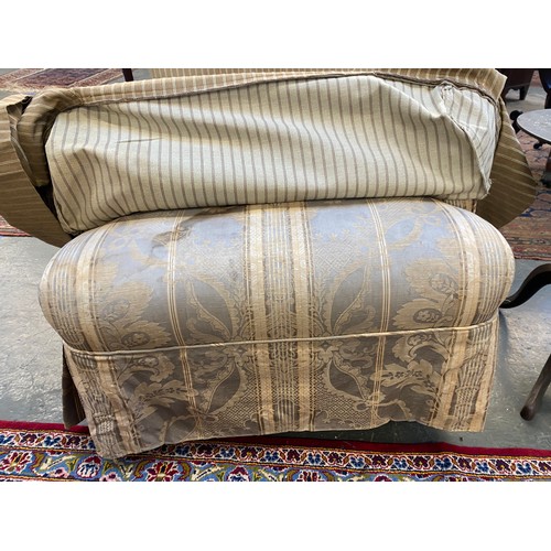 455 - A pair of Howard & Son Bridgwater armchairs, with striped loose covers, on turned front legs with st... 