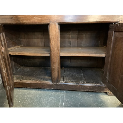 361 - An 18th century oak dresser, the rack with moulded pediment over three shelves and two cupboards, fl... 