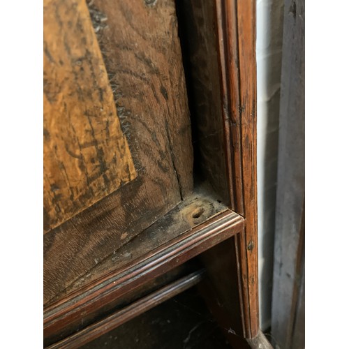 361 - An 18th century oak dresser, the rack with moulded pediment over three shelves and two cupboards, fl... 