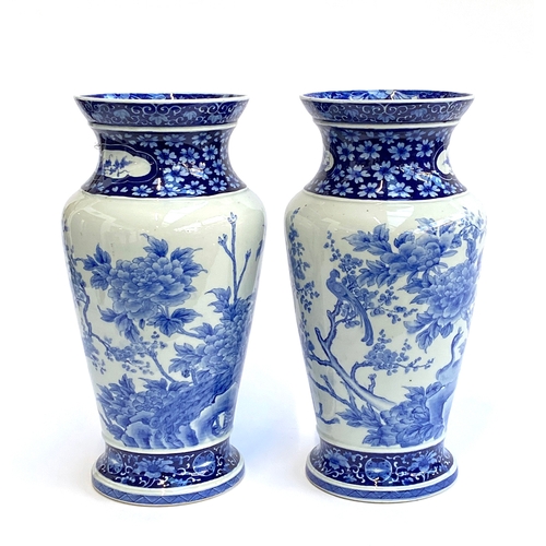 235A - A pair of large Japanese blue and white porcelain vases depicting birds and chrysanthemums, 41cmH