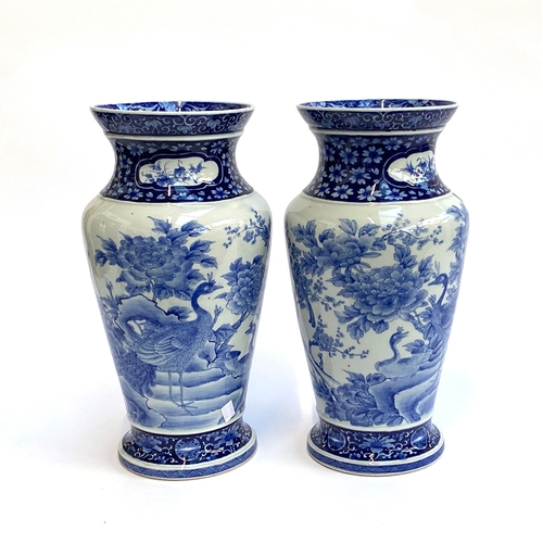 235A - A pair of large Japanese blue and white porcelain vases depicting birds and chrysanthemums, 41cmH