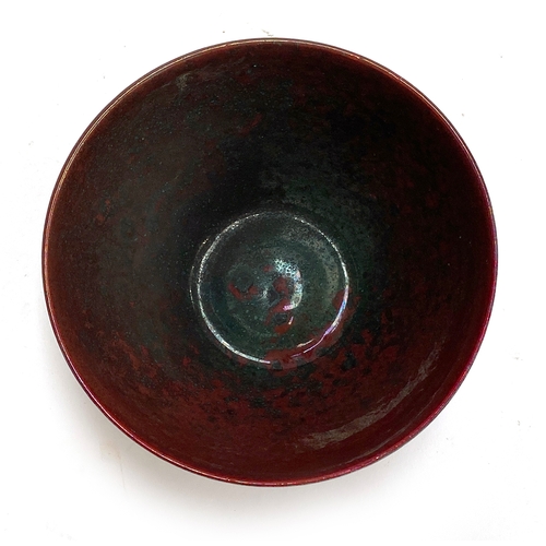 135 - Abdo Nagi (Yemeni-British, 1941-2001) a red lustre studio pottery bowl in a bird design, marked to b... 