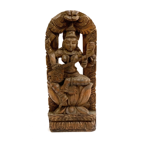 360 - A large carved wooden figure of the Hindu Goddess Saraswati, 59cmH