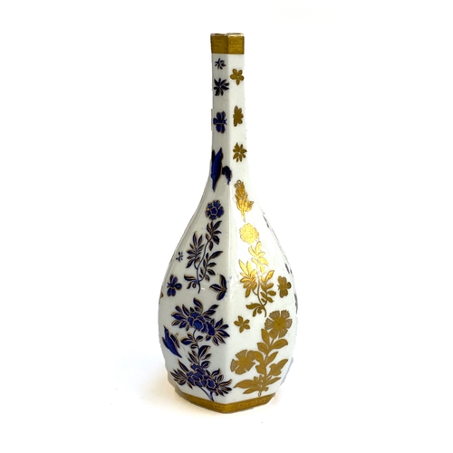 111 - A Meissen style porcelain hexagonal bottle vase, blue, white and gold floral decoration, Greek key d... 