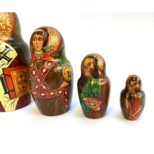 689 - Russian matryoshka dolls painted with Russian Orthodox icons, signed tallest 21cmH, smallest 4.5cmH