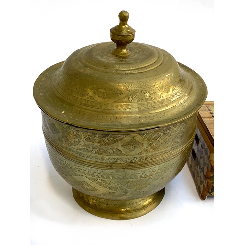 278 - A Japanese puzzle box; together with an Eastern brass lidded pot, 25cmH