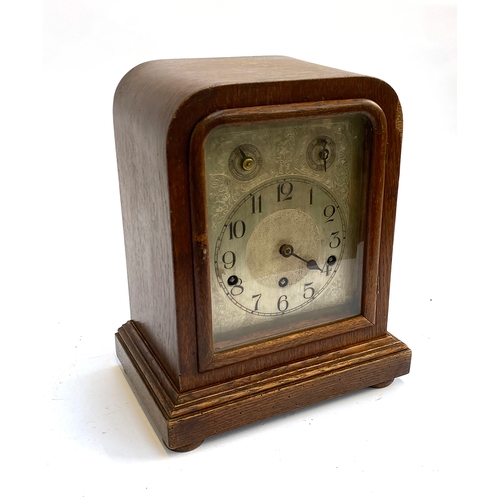 280 - A German wooden mantle clock, with bevelled glass, 32cmH