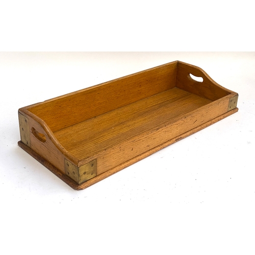 984 - A light oak and brass bound twin handled book trough, 66cmW