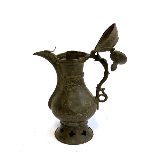 285 - Eastern bronze dallah coffee pot with quatrafoil cutouts and double hinged lid, 31cmH