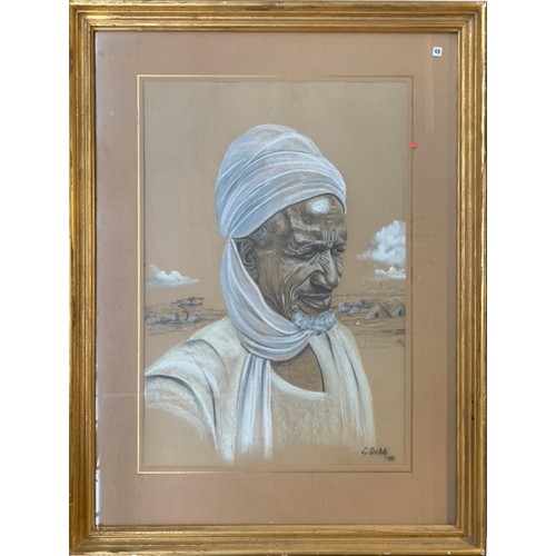 718 - Lucy Gibb (American, 20th), Bedouin portrait, pastel and chalk, signed and dated '78, 57x36.5cm; in ... 