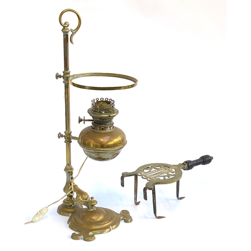 365 - A 19th century brass oil lamp, converted for electricity; together with a small brass and steel triv... 