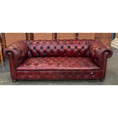 832 - An oxblood leather button upholstered chesterfield sofa, 200cmW

Provenance: Ashley Chase House