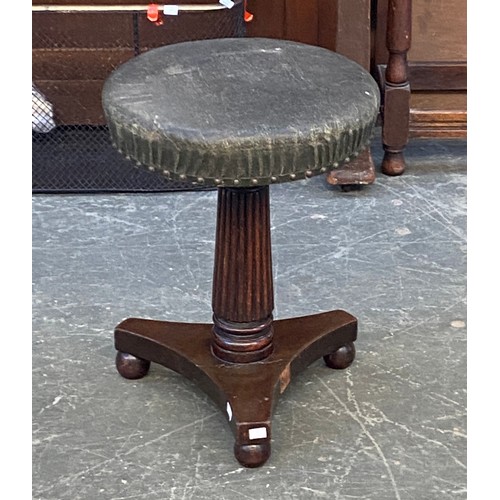 948 - A good 19th century adjustable piano stool on a reeded tapering column and triform base, 53cmH