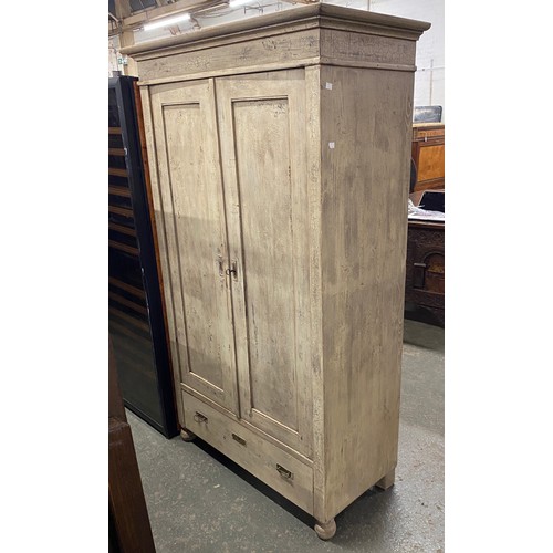 991 - A Swedish painted pine hanging wardrobe with panelled drawers over a single drawer, 110x53x183cmH