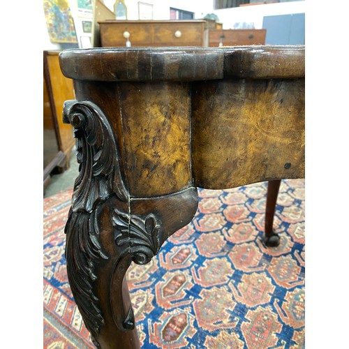 1015 - A 19th century walnut gateleg card table, with foldover top opening to a grospoint interior depictin... 