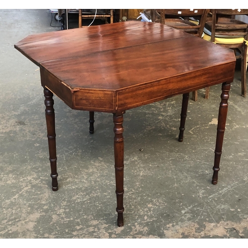 1032 - A George III mahogany tea-table with canted corners on ring-turned tapering legs, 97x45x75cmH