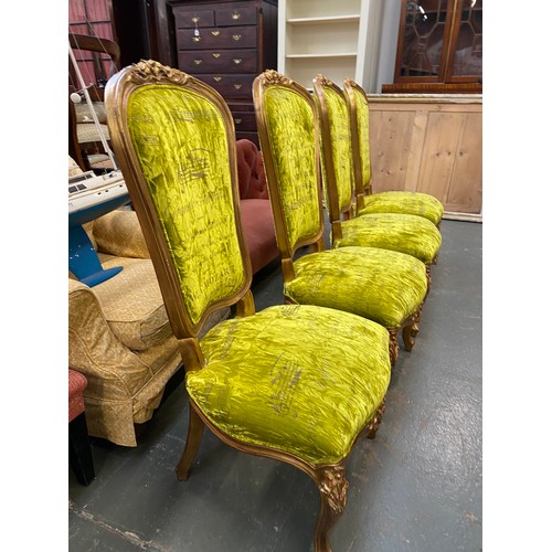 882 - A set of four Louis XV style giltwood side chairs upholstered in bright green velvet fabric