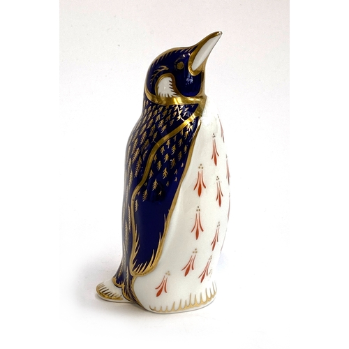 215 - A Royal Crown Derby penguin paperweight, marked LXVIII to base, 14cmH