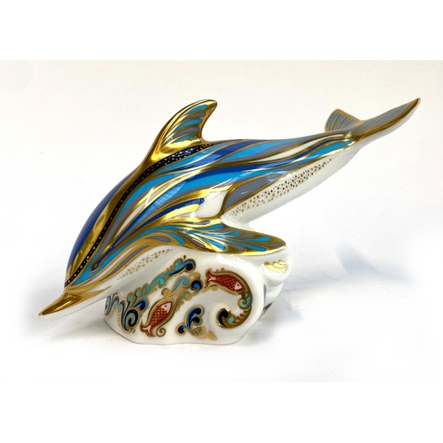 216 - A Royal Crown Derby dolphin paperweight, 17.5cmL