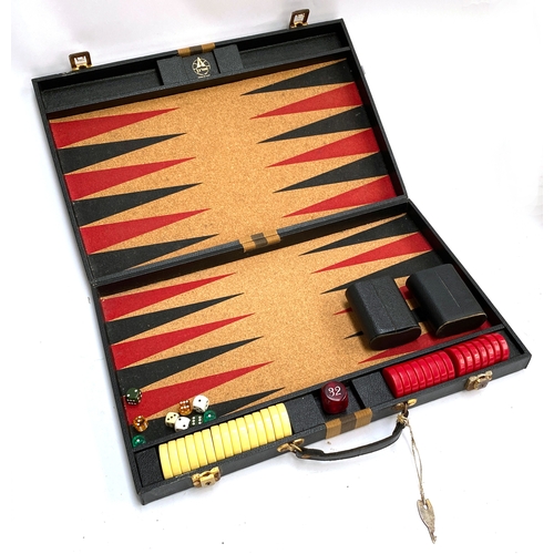 414 - Aries backgammon set in leather case with key, 52cmW