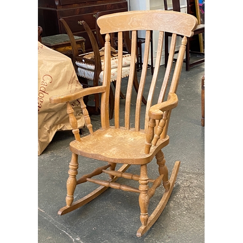 873 - A beech lathe back rocking chair