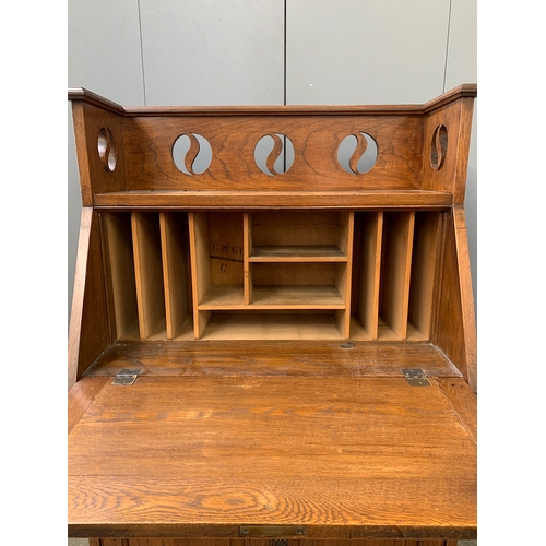 924 - An Arts and Crafts oak students bureau, 78cmW