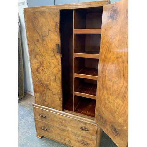 927 - An Art Deco burr walnut gents wardrobe, with hanging rail, over two drawers, 87x42x168cmH