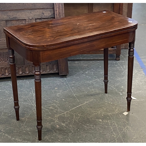 942 - A Regency mahogany card table on ring turned tapering legs, 90cmW, 74cmH