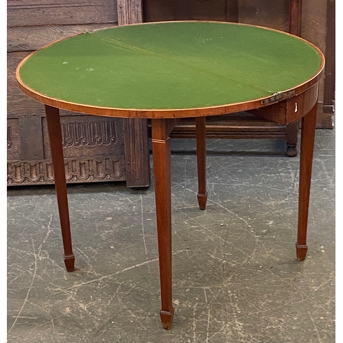 946 - A George III demilune mahogany and boxwood strung card table on square tapered legs and spade feet, ... 