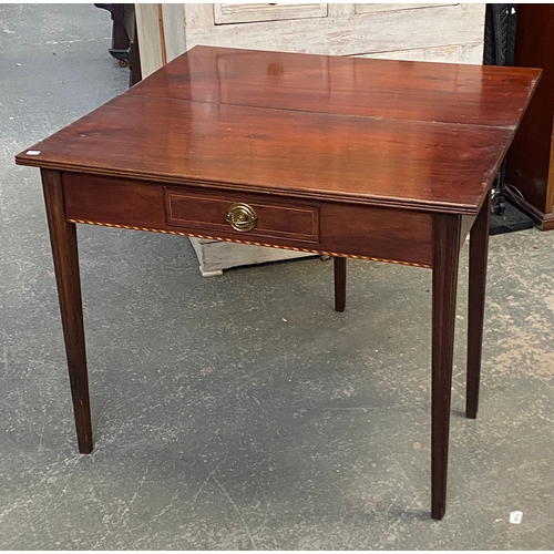 1053 - A 19th century tea table with single frieze drawer, on moulded square section legs, the apron with b... 