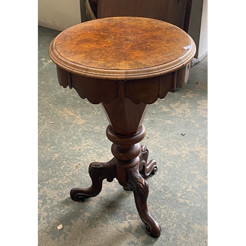 1077 - A Victorian circular walnut work table on carved cabriole tripod legs, 47x68cmH