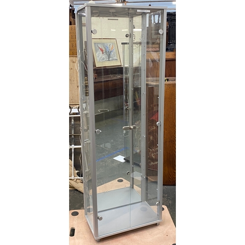 1102 - A modern glazed display cabinet, with mirrored back, 58x32x172cm (labelled cabinet 11)