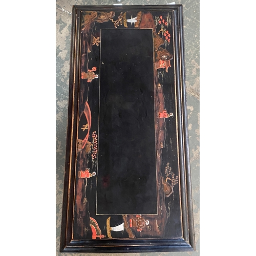 1121 - A black japanned occasional table with book trough below, 61x29x62cmH