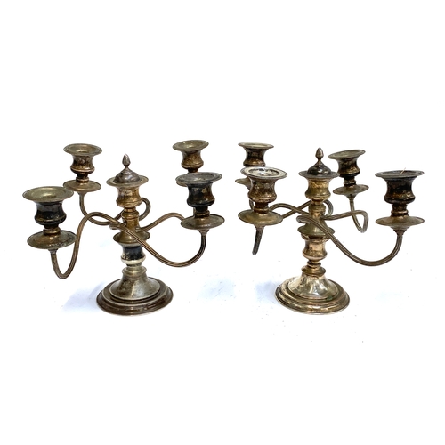 93 - A pair of silver plated four arm candlesticks, each approx. 23cmH