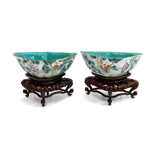 232 - A pair of Chinese porcelain shaped dishes, painted depicting figures in a landscape, turquoise inter... 