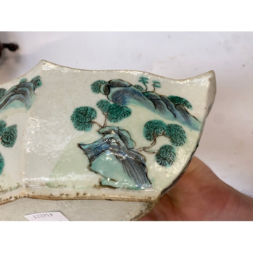 232 - A pair of Chinese porcelain shaped dishes, painted depicting figures in a landscape, turquoise inter... 