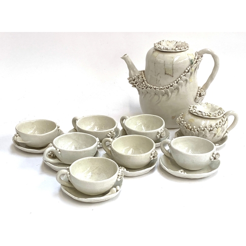 462 - Delores Demurtas (Sardinian, 1935-2023), a set of eight white majolica teacups and saucers, teapot a... 