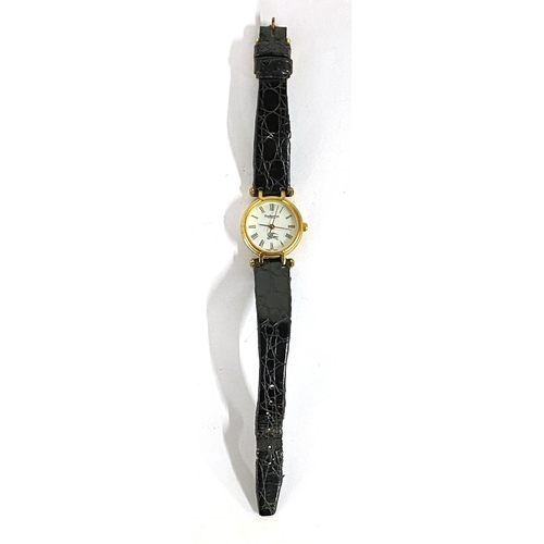 100 - A ladies Burberrys watch, with black leather strap