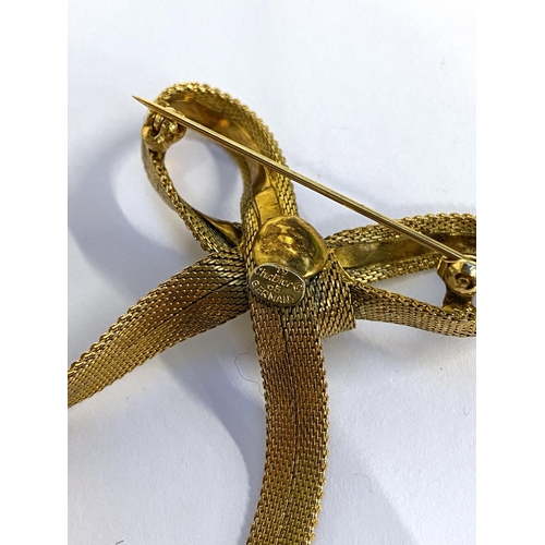 16 - A vintage Christian Dior gold tone mesh bow brooch, marked to reverse, 5cmW; together with a Grosse ... 