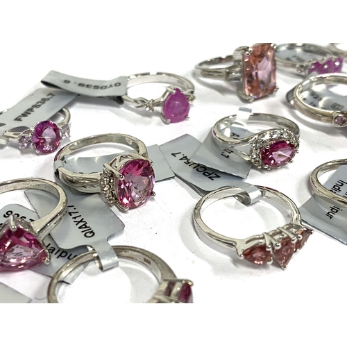 43 - A lot of 17 new 925 silver rings set with pink stones to include pink sapphires, pink topaz etc, gro... 